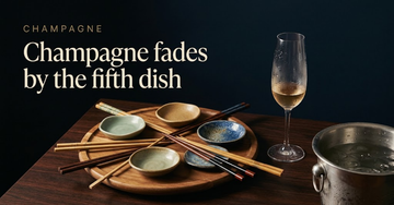 A lazy Susan holding five empty sauce dishes and mismatched chopsticks, one champagne flute sweating onto dark rosewood — Champagne fades by the fifth dish