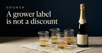 A single unlabelled Champagne bottle beside blending beakers holding different straw coloured wines and a folded vineyard map — A grower label is not a discount
