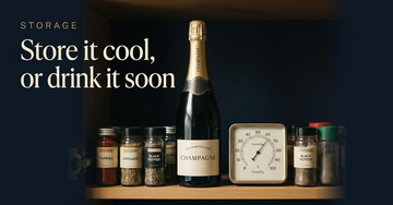 An unopened Champagne bottle standing in a small flat kitchen cupboard between spice jars, a humidity gauge on the shelf — Store it cool, or drink it soon