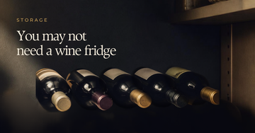 Wine bottles lying on their side in an ordinary domestic cupboard — You may not need a wine fridge