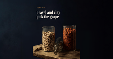 Two glass cylinders hold pale gravel stones and dense reddish clay side by side on a low table — Gravel and clay pick the grape