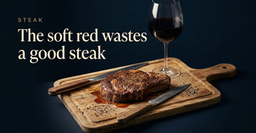 A thick seared ribeye resting on a wooden board with juices pooling beneath and a carving knife laid across it — The soft red wastes a good steak