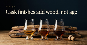 Three whisky glasses of differing amber hues lined up, oak staves behind them stained by sherry, port and Sauternes — Cask finishes add wood, not age