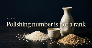 A ceramic sake flask and small cup beside two piles of rice, one polished bright white and one still husked and brown — Polishing number is not a rank