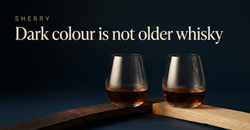 Two whisky glasses of near identical deep amber liquid, one against a dark sherry stained cask stave, the other against plain oak — Dark colour is not older whisky