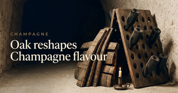 Stacked oak barrel staves leaning against a champagne riddling rack inside a chalk cellar, a single candle burning nearby — Oak reshapes Champagne flavour
