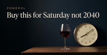 A glass filled two thirds with red wine beside a kitchen clock reading an evening hour on a plain weekday table — Buy this for Saturday not 2040