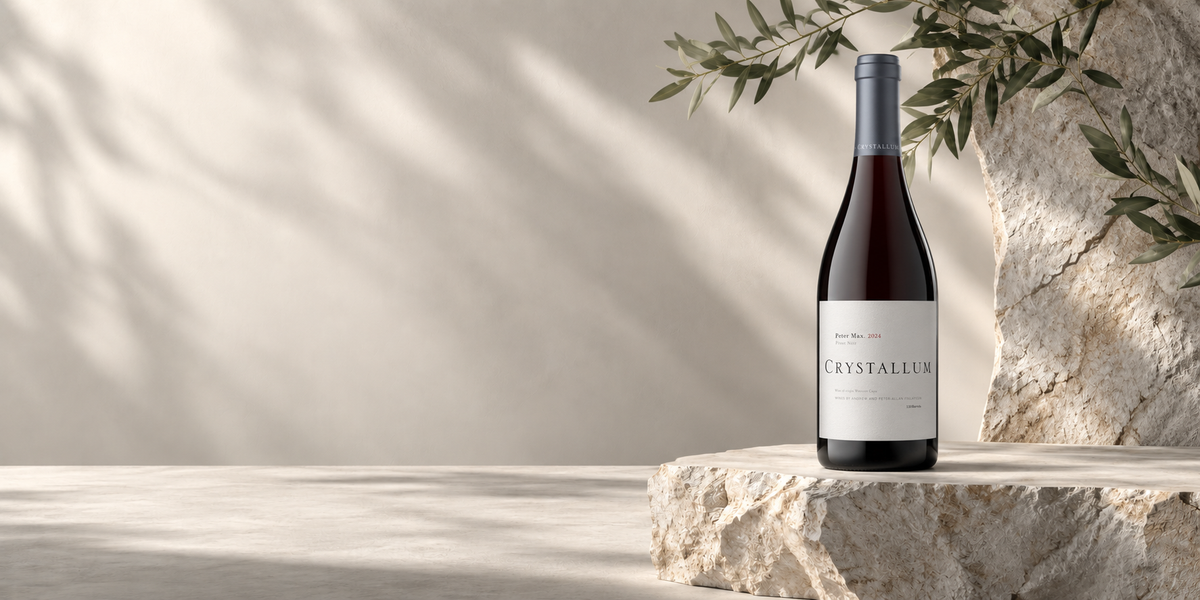 Crystallum wine bottles on a natural stone background